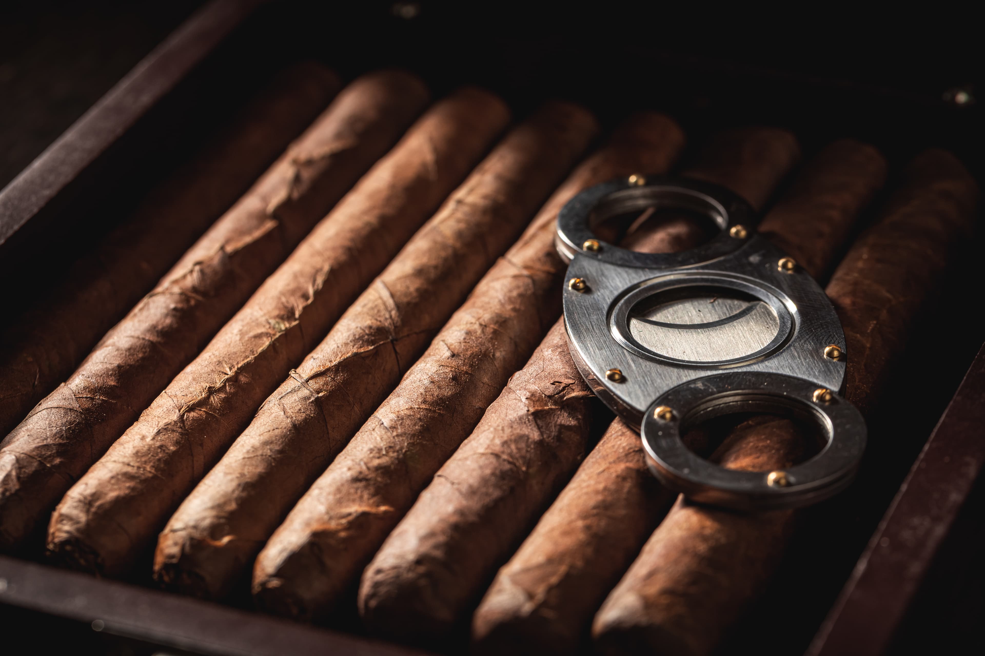 A cigar box and cutter